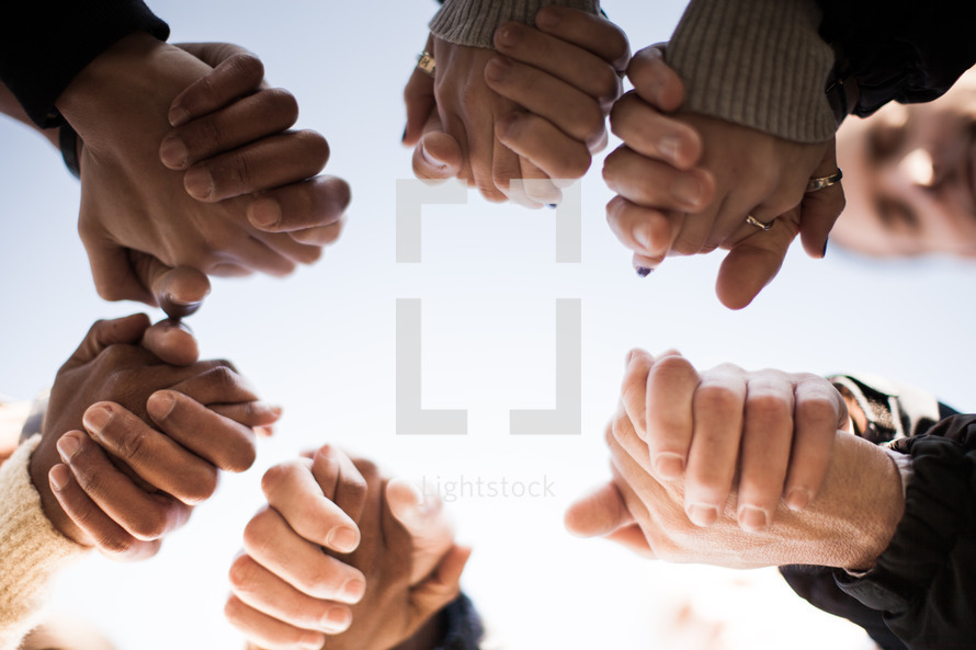 Stock Photo - Holding hands in prayer by Pearl - Lightstock